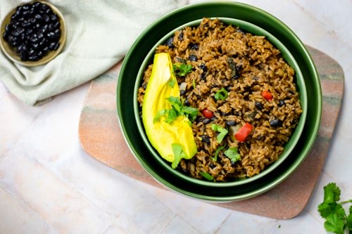 a plate with the dominican moro de habichuela also non as rice and black beans.